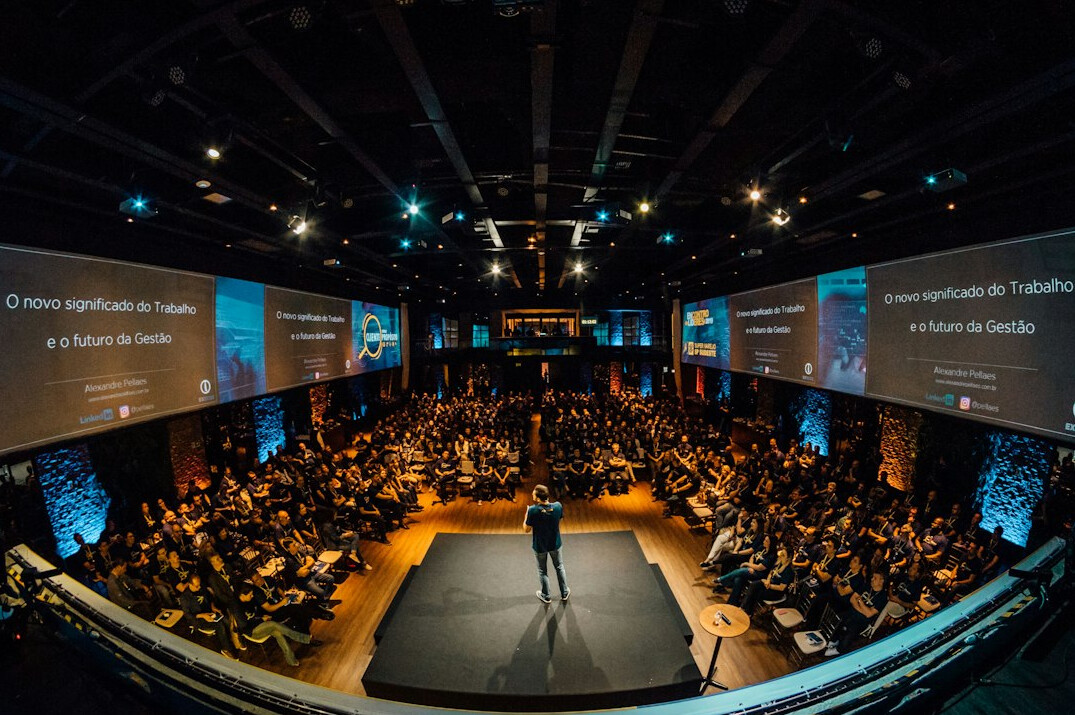 business leader on stage presenting