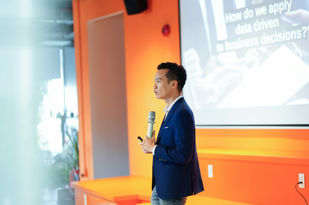 executive speaking on stage